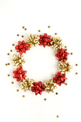 christmas wreath or new year decorations background in gold pink colors on white   background with empty copy space for text. holiday and celebration concept for postcard or invitation. top view 