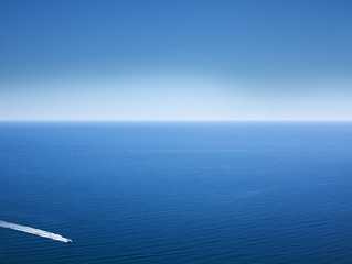 Black Sea. Calm. The water is saturated blue. Pleasure boat.