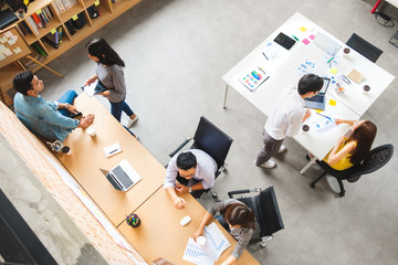 Group of Asian business people and creative designer meeting in office