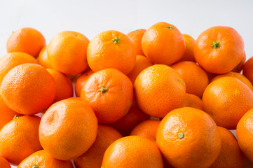 Fresh tangerines. Ripe and tasty mandarins. Clementines. Background tangerines.