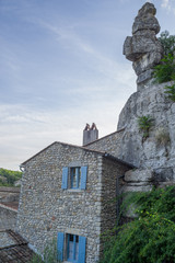 Fototapeta na wymiar Stone house in the village of Labeaume overcome of a rocky peak, Ardèche, France.