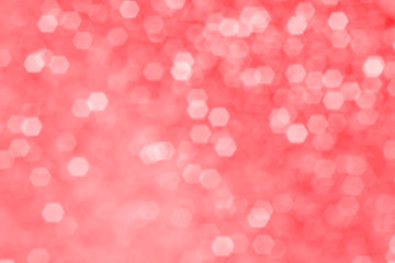 Christmas background - blurred abstract with sparkles, beautiful bokeh. Monochrome image in tones of Flame Scarlet.