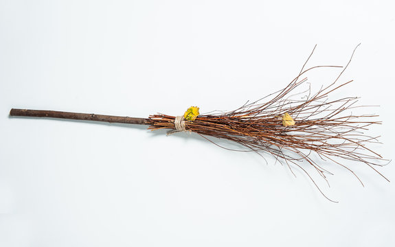 Halloween concept. Witch magic broom isolated on a white background. A besom or more commonly known as the witches broom.