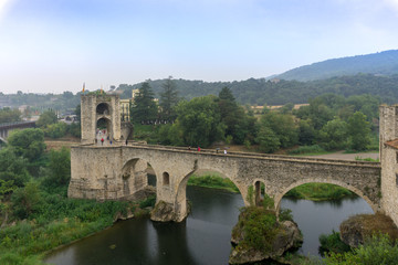 Fototapeta na wymiar Medieval village Besalu. Bridge over the river Fluvia. Girona