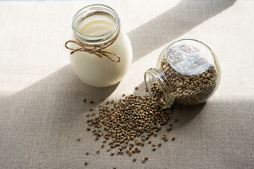 Fototapeta na wymiar vegan fresh milk from hemp seeds in a glass jar, clean eating, non-dairy milk