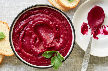 Thick beetroot cream soup in a bowl 