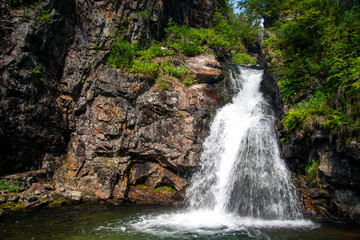 Waterfall. Mountain waterfall. Mountain river.