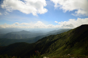  The mountain ranges of Satan and Hamar-Daban. Mountain peaks and valleys. Mountain landscape. The nature of Siberia.