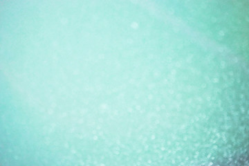 Soft defocused blue background with sparkles. Atmosphere of the New Year mood.