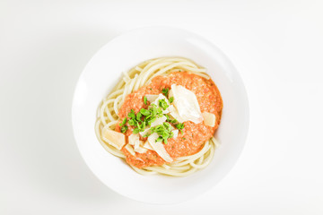 Italian pasta with tomato sauce, parmesan cheese, fresh oregano - on white background.