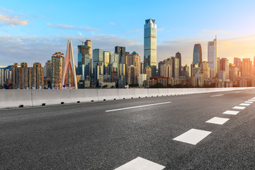 Asphalt highway passes through the city financial district in Chongqing at sunset,China.