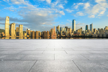 Obraz premium Empty square floor and cityscape with buildings in Chongqing at sunset,China.