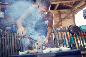 Barbecue making outdoors on a regular / vintage grill.