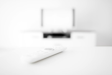TV with white screen on a stand in the room.