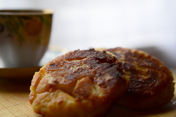 Cheesecakes on a wooden board, closeup. 