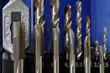 Stainless steel taps in set.