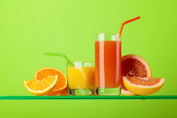 Naklejka na ściany i meble Glasses of fresh grapefruit and orange juice.