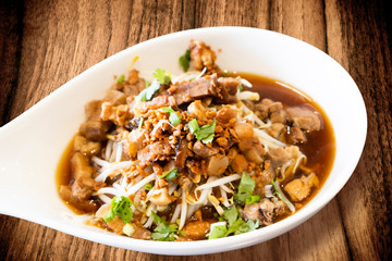 Chinese traditional tube noodles on a wooden table