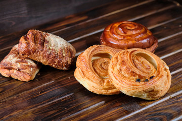 buns with berry jam on a dark wooden background. Rustic style. Close-up. Selective focus