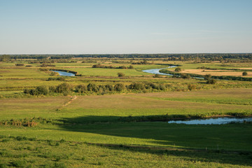 Obraz premium View from the settlement on the Biebrza estuary to Narew in Wizna, Podlaskie, Poland