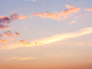 clear orange yellow sky background with blue clouds sunset or sunrise morning abstract texture.