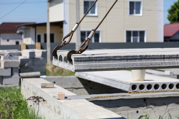 Installing concrete slabs at a construction site at home