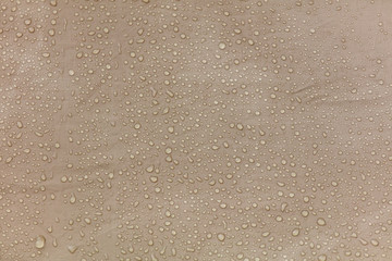 Raindrops on a tent as an abstract background