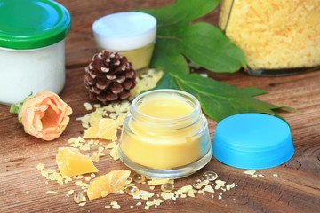 Fototapeta na wymiar Homemade natural lip balm. Made from beeswax, sheabutter, olive and coconut oil mixed together.
