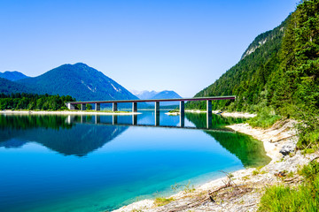 bridge at the sylvensteinspeicher lake in bavaria