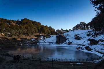 Serloysar Lake frozen on the surface in Tirthan Valley, Himachal Pradesh