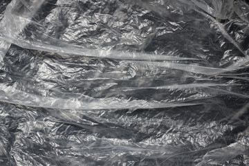 Clear transparent plastic bag texture background. Waste recycling concept. Crumpled polyethylene and cellophane.