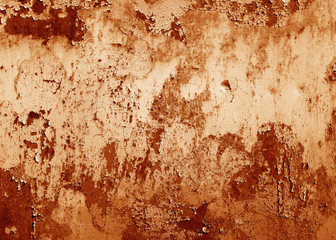 Grungy rusted metal surface in orange tone.