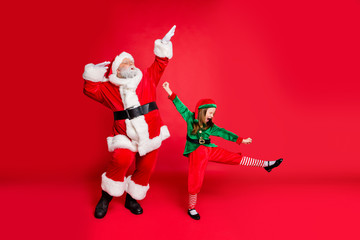 Full size photo of excited funny santa claus and elf with eyewear eyeglasses spectacles dancing...