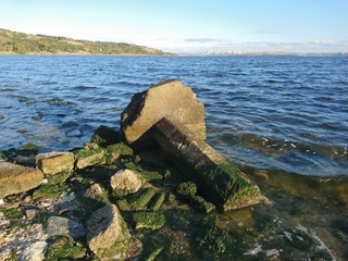 old pillar on shore of lake Kucukcekmece in Istanbul