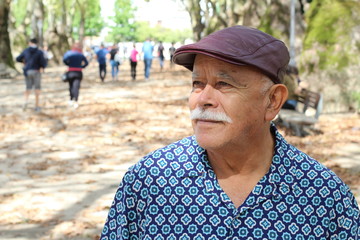 Senior Hispanic man outdoor headshot