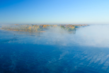 Fog over the water on a river Dnieper on autumn