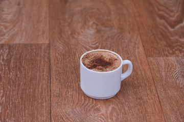 Coffee cup top view on old wooden