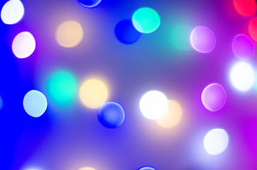 Multi-colored bokeh in neon colors. Good New Year spirit.