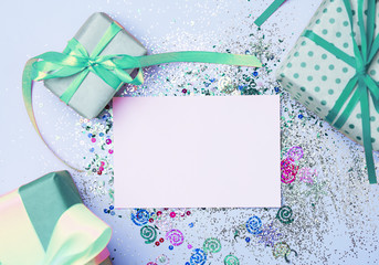 Gift boxes on a beautiful mint background . Holiday concept