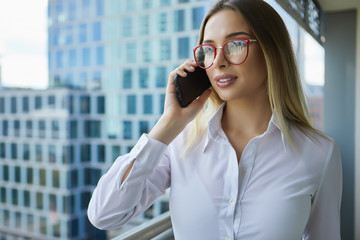 Beautiful business woman on the background of the modern office
