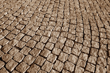Stone pavement texture in brown tone.