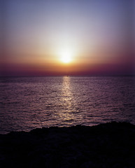 Obraz premium sunrise with boat on the horizon 