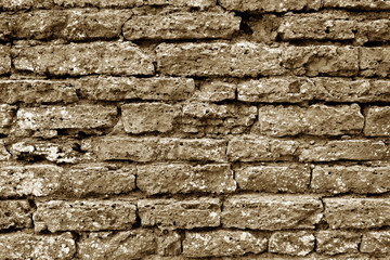 Old grungy brick wall texture in brown tone.