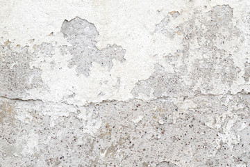 white cracked paint on cement wall