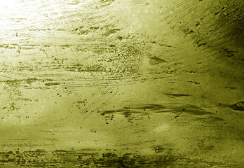 Metal rough surface in yellow tone.