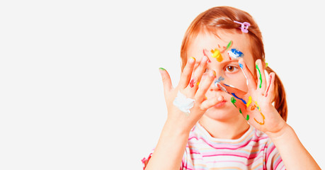 Humorous portrait of excited cute young girl color painted hands. Selective focus.