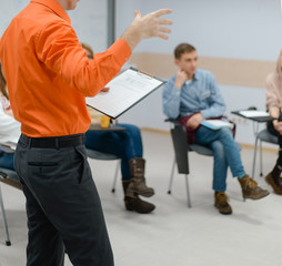 Lecturer conducts a lecture, training.