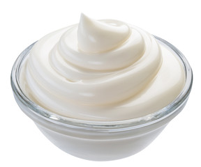 Mayonnaise swirl in glass bowl. Clipping path.
