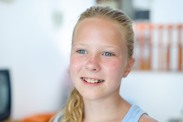 A teenage girl with a removable orthodontic appliance. Smiling with a bracket on her teeth. The...