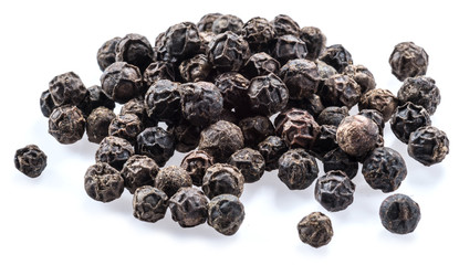 Black peppercorns isolated on white background.
